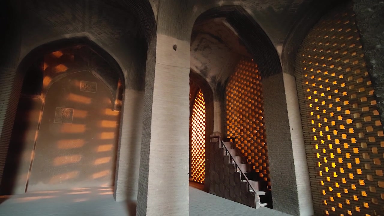 Sunlight Streaming Through Ornate Lattice Windows in Ancient Stone Building