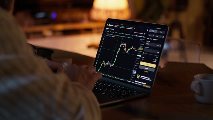 Person Trading Stocks at Home at Night
