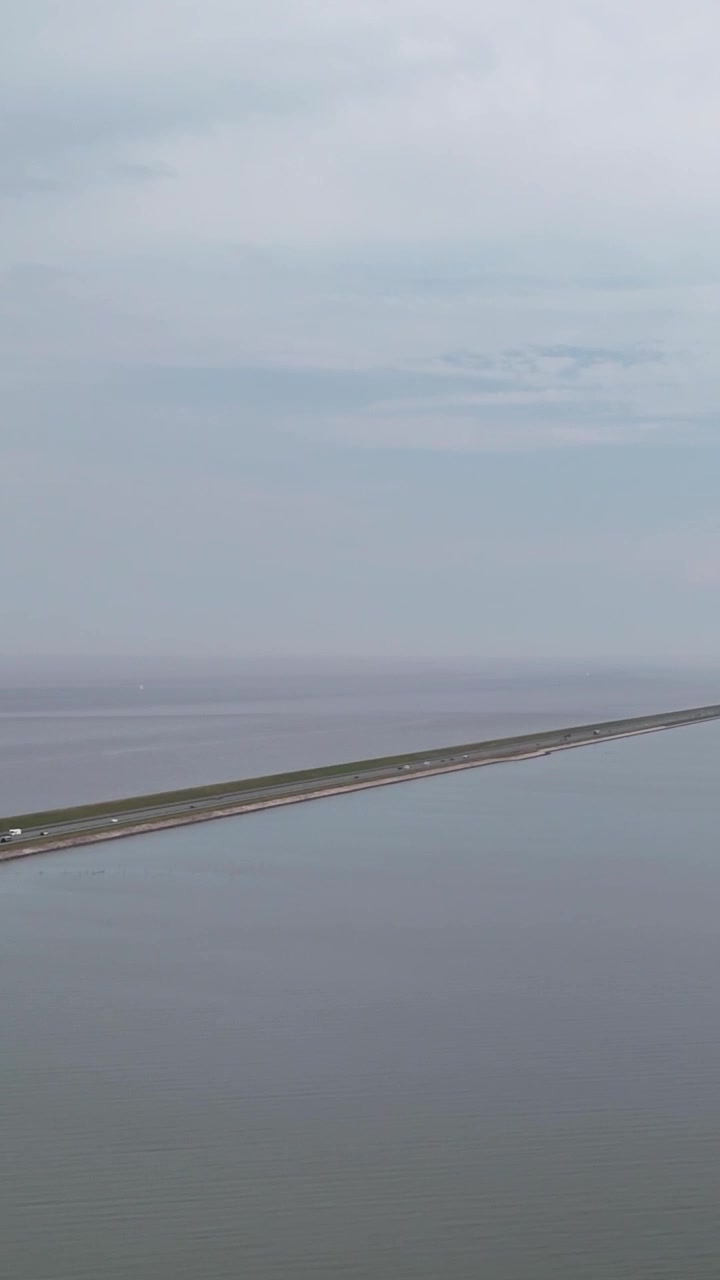 Aerial View of Cars Driving on the Afsluitdijk Causeway in the Netherlands