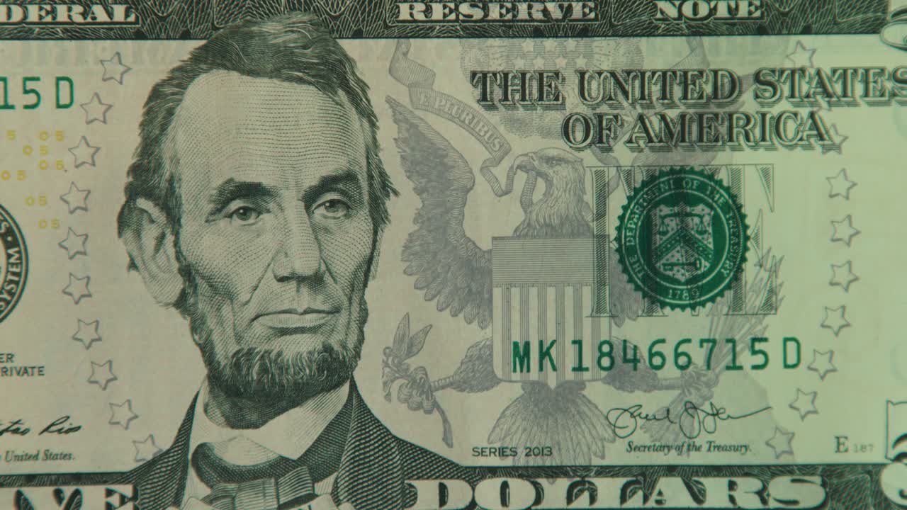 Close-up of a Five Dollar Bill Featuring Abraham Lincoln