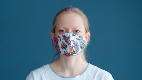 woman wearing a floral patterned face mask