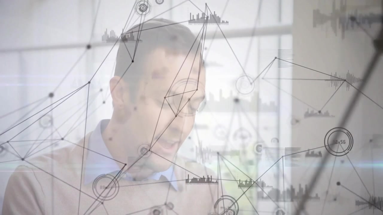 Male professional tapping tablet to activate tech data overlay and analyzing charts in office