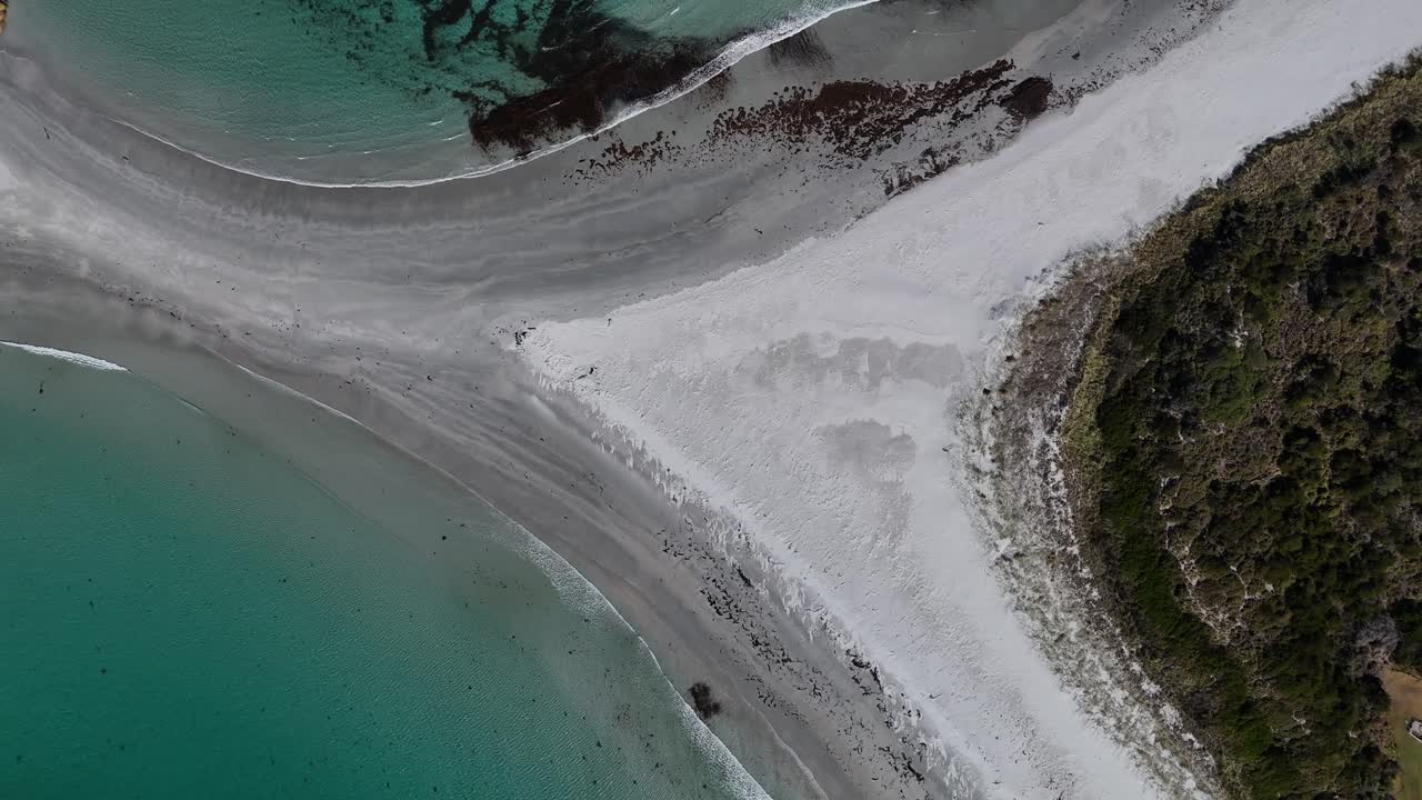 White sand beach connected to a sandbar towards Diamond Island, aerial top down
