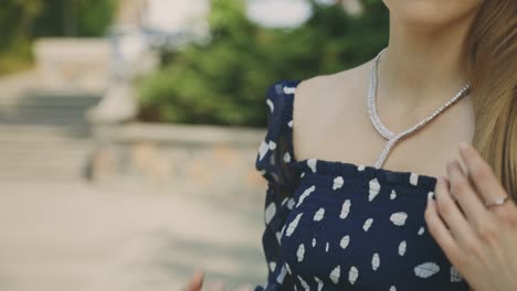 cropped portrait of elegant woman wearing precious jewelries - rack focus