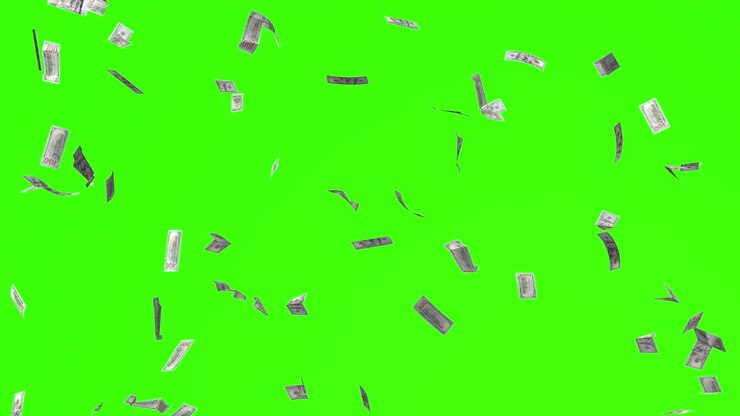 緑の画面に落ちるドル紙幣