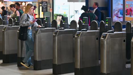ticket barriers at a busy public transport station