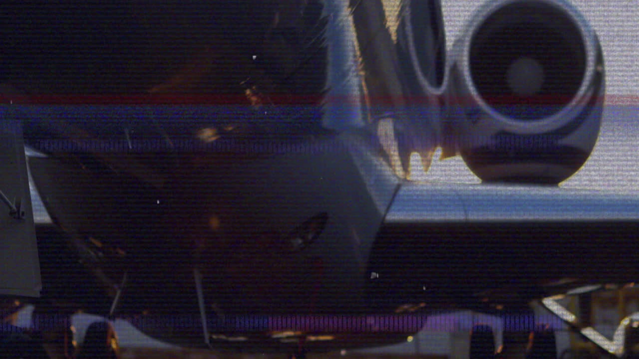Animation showing airplane engine and fuselage with digital glitch effect