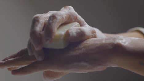 macro shot of hands washing carefully with soap, personal hygiene