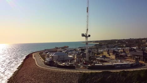 coastal view of claytons residences and marina with sunny skies in mindarie, australia