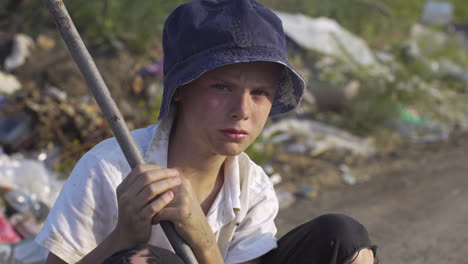 portrait of a boy in poverty