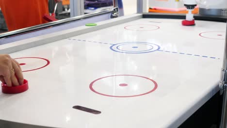 person playing air hockey