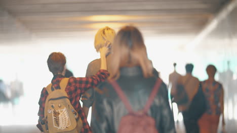 people walking in underground tunnel