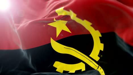 bandera de angola agitando lentamente. agitando la bandera de cerca. bucle sin costuras