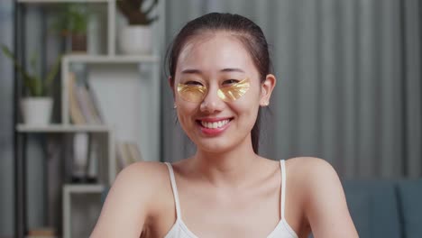 woman with gold eye patches