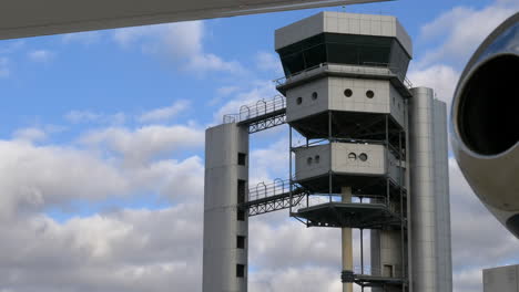 Alicante-Airport-Air-Traffic-Control-Tower,-Executive-Private-Jet-Foreground