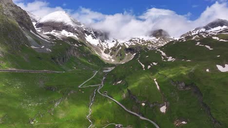 aerial view of a winding mountain road in the alps