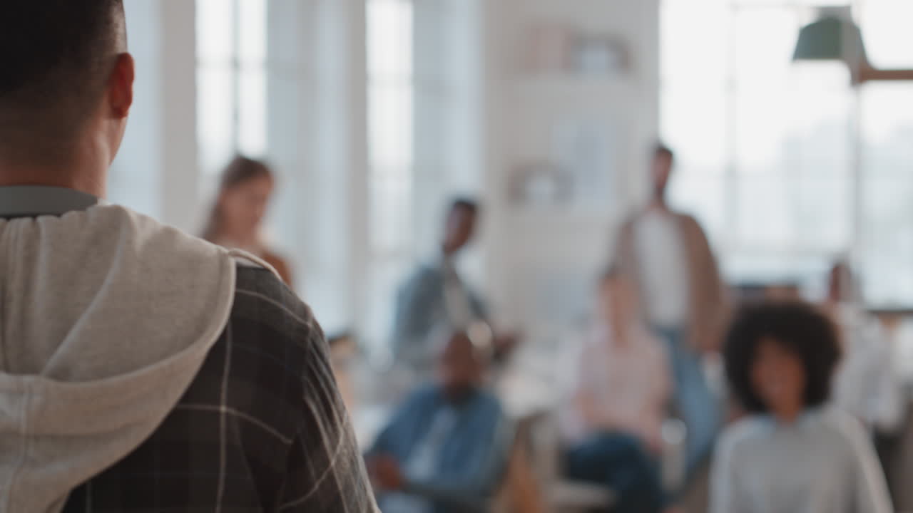 young businessman team leader shouting at colleagues in office meeting discussing performance in workplace