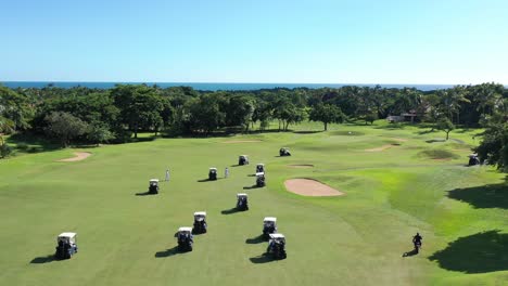 aerial view of golfers racing to reach the final hole at a country house located in la romana