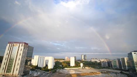 rainbow over city skyline