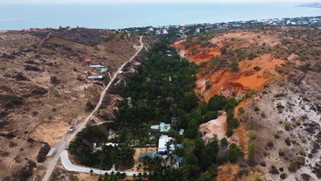 aerial flying over fairy stream, red sand hill on right side, mui ne, vietnam