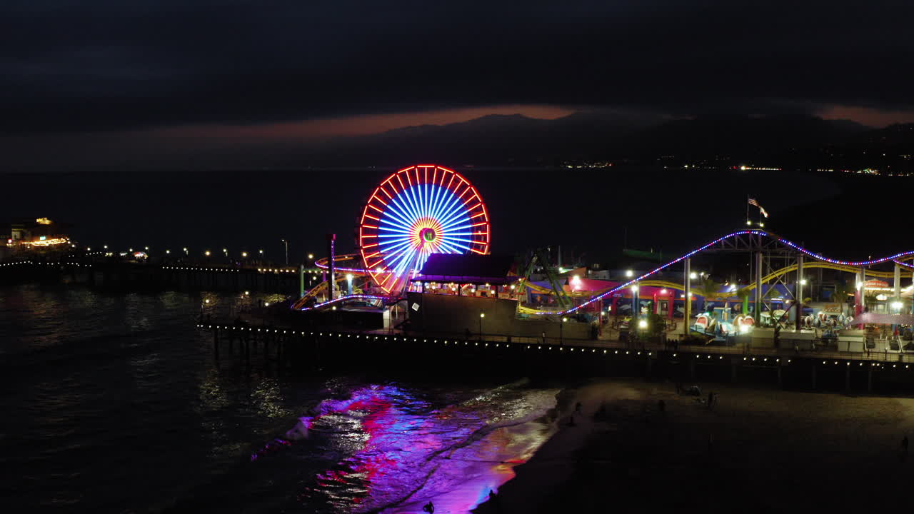 Vibrant Night at Santa Monica Pier with Ferris Wheel Lights