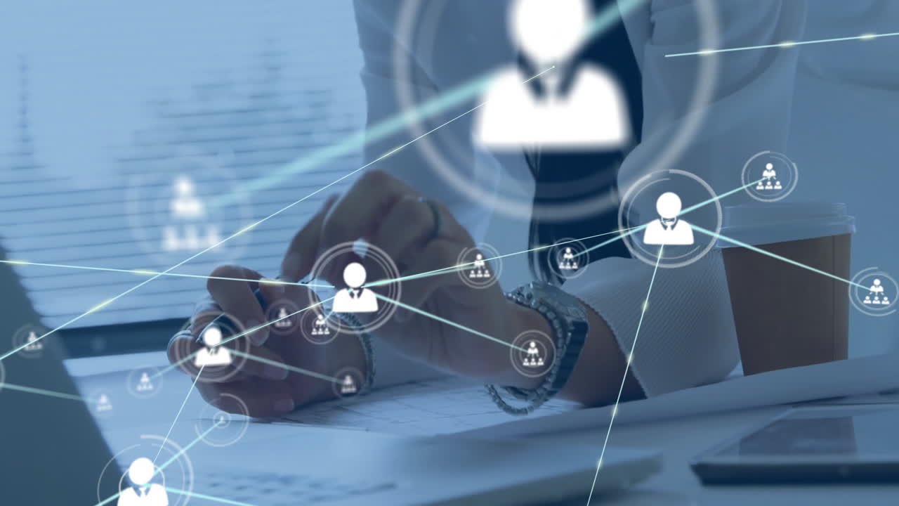 Business professional writing documents at office desk, featuring pen, laptop and network icons