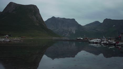 selfjorden lake with reflections at flakstadvåg village on the island senja in northern norway