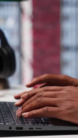 vertical video freelancer creating articles content for his online blog at home desk