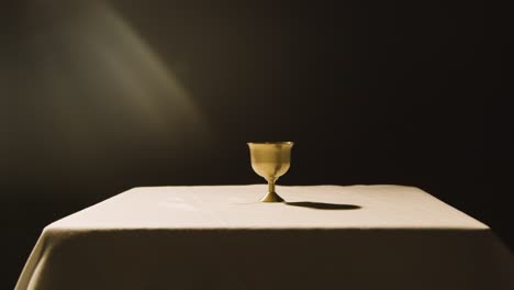 Religious-Concept-Shot-With-Chalice-On-Altar-In-Pool-Of-Light-1