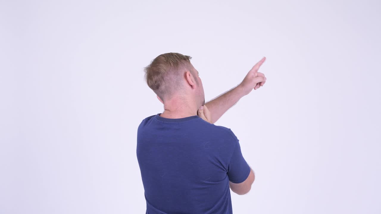 Rear view of mature man with blond hair thinking