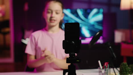 gen z kid filming pov style video with phone for online channel, talking with viewers