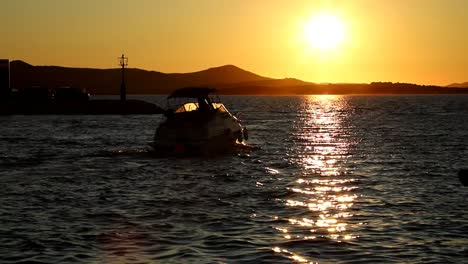 boats and yachts enter and exit marina at sunset in biograd in croatia speed up