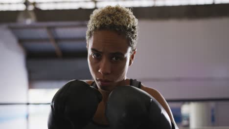 Mixed-race-woman-with-boxing-gloves