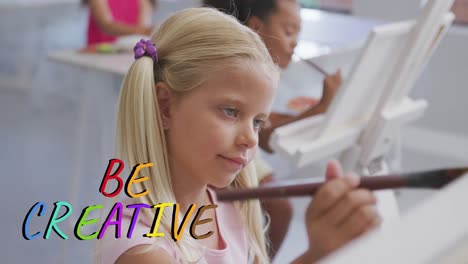 animation of be creative text in multi colours over happy caucasian schoolgirl painting in art class