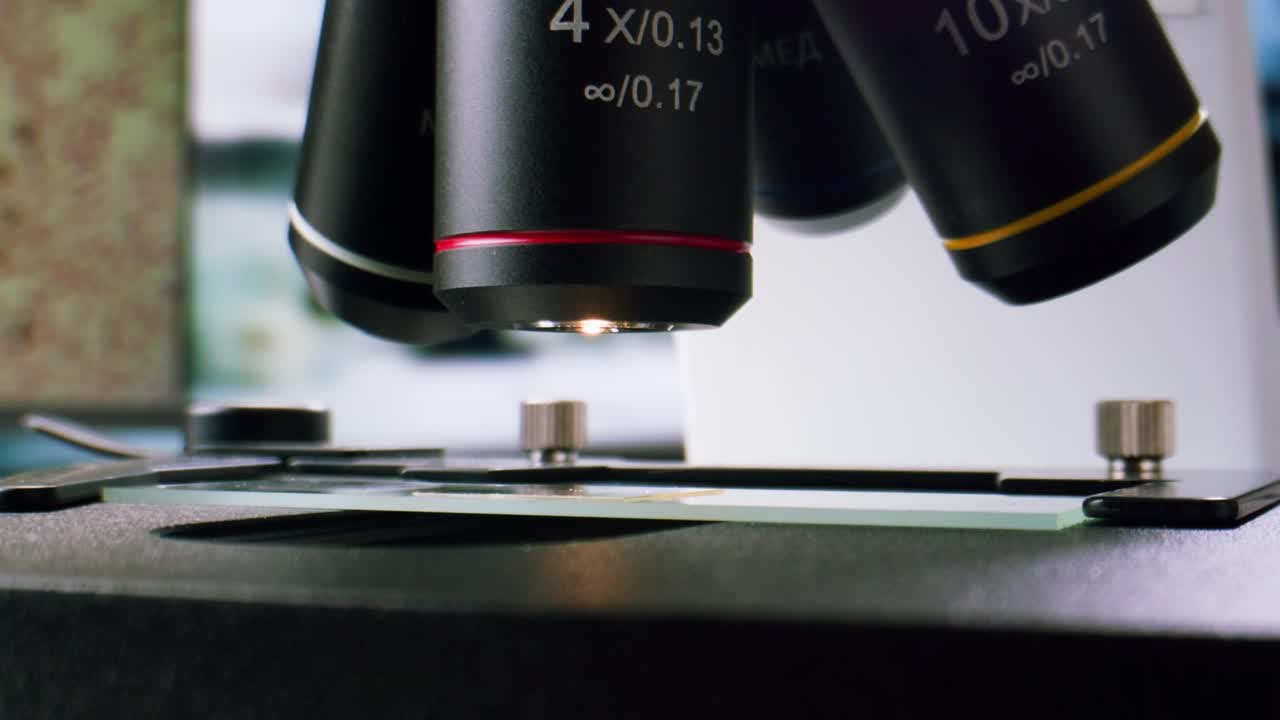 Close-up of Microscope Objective Lens Being Rotated