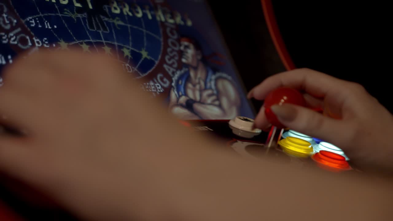 Person playing an arcade game