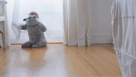 happy-baby-playing-at-home-toddler-having-fun-learning-looking-curious-infant-exploring-childhood-wearing-funny-pajamas