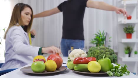 Dietitian measuring her patient&#039;s weight and waist with a tape measure.