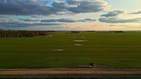 Tranquil-aerial-view-of-peaceful-rural-countryside-landscape-with-clouds