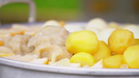 potatoes, tofu and eggs steaming in a steam pot