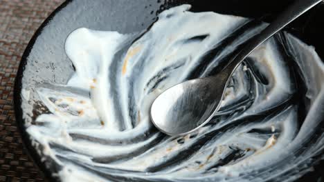 empty bowl with yogurt and spoon