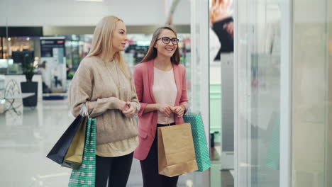 two women shopping in a mall