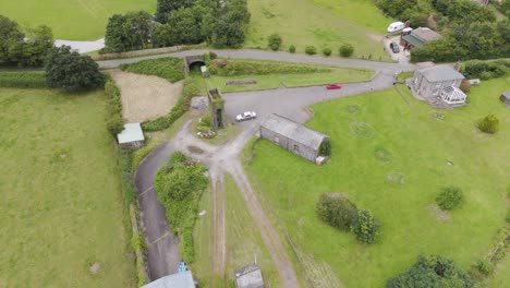 aerial view of a rural landscape with old stone buildings and fields