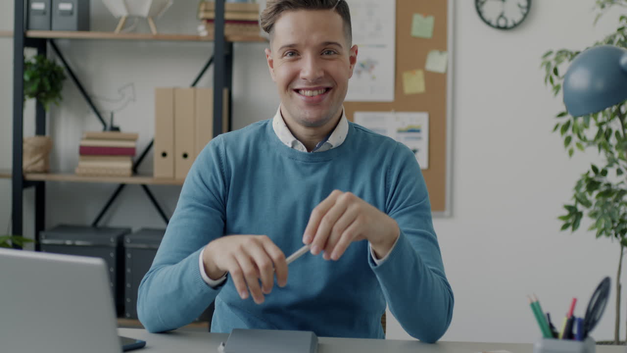 Happy Businessman at his Desk