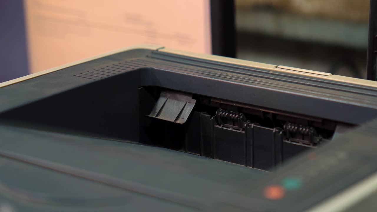 Office Printer Feeding White Paper Documents After Print In The Workplace, Close Up Shot