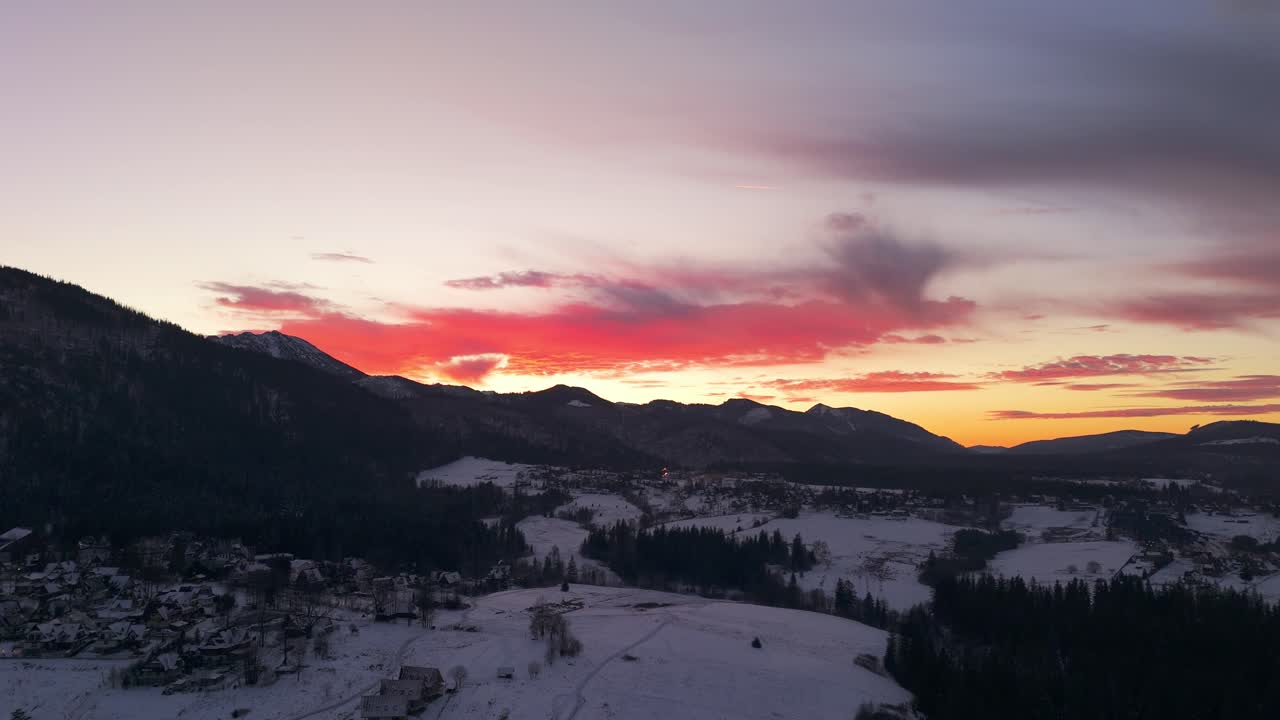 Wooden chalets under remaining light, stars take over the canvas of night