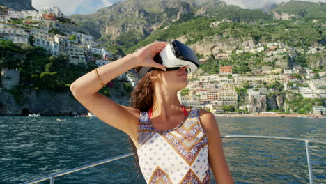 woman experiencing virtual reality on a boat in positano, italy