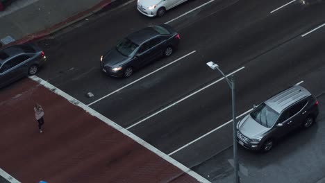 time lapse of dusk traffic at intersection in downtown la