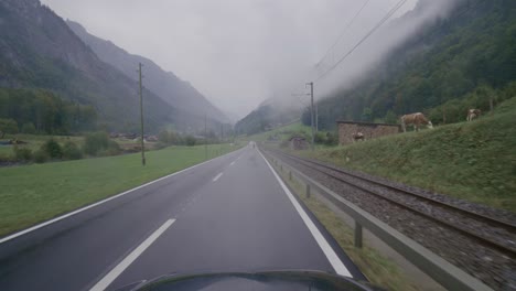 driving from interlaken to grindelwald in the swiss alps in pouring rain