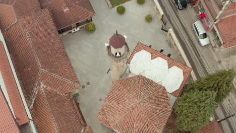 scenery of muslim people getting out from mosque at downtown of novi pazar, serbia